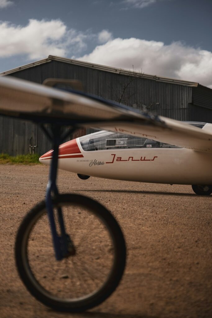 a small airplane on a dirt road